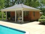 Pool cabana incorporated into landscape design at residence located near Beachwood Ohio